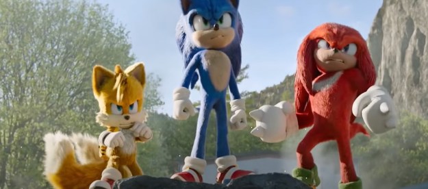 Sonic, Tails, and Knuckles stand beside each other in team formation in Sonic the Hedgehog 2.