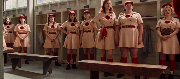 The Rockford Peaches stand together in their locker room in Amazon's A League of Their Own.