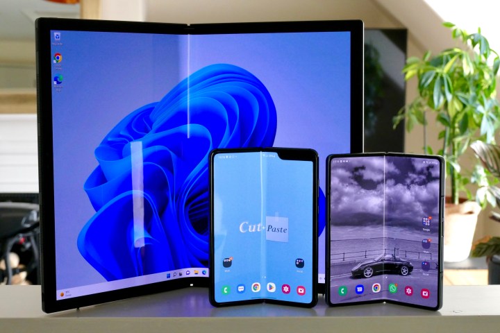 The Asus Zenbook Fold 17 with the Galaxy Z Fold 4 and Galaxy Fold.