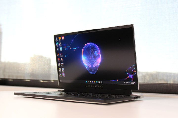 The Alienware x14 in front of a window.