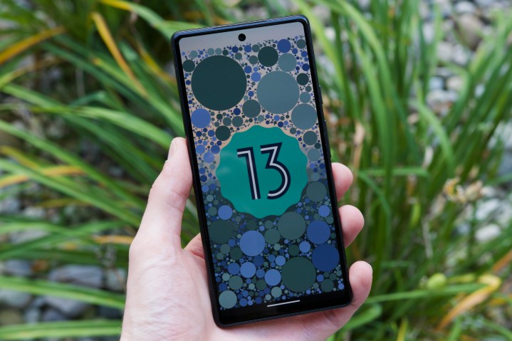 Android 13 logo on a Google Pixel 6a.