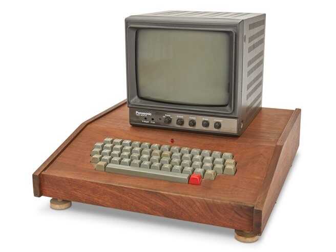 An original Apple-1 computer in its wooden case.