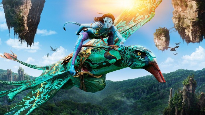 A blue alien rides a flying dragon in Avatar 2.