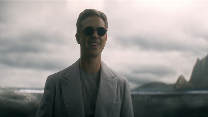 Boyd Holbrook wears sunglasses as The Corinthian in a scene from The Sandman.