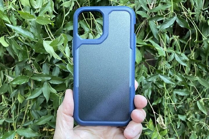 Hand holding an iPhone case.