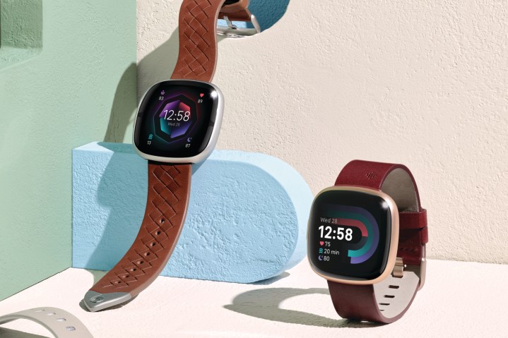 Lifestyle photo of the Fitbit Versa 4 and Fitbit Sense 2.