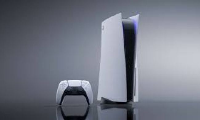 A PS5 stands on a table.