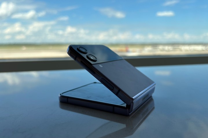 The Samsung Galaxy Z Flip 4 sitting on a table.