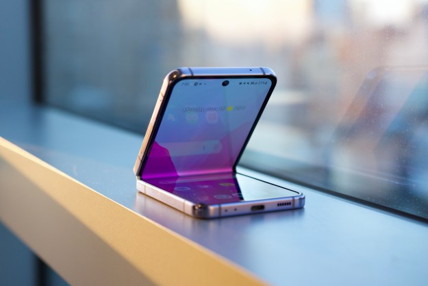 The Samsung Galaxy Z Flip 4 sitting on a window ledge.
