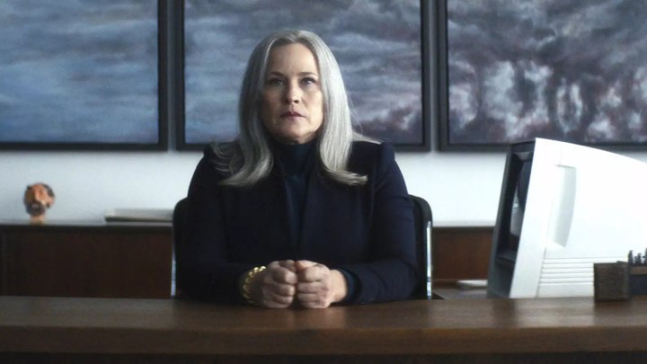 Patricia Arquette sitting behind a desk as Harmony Cobel in Severance.