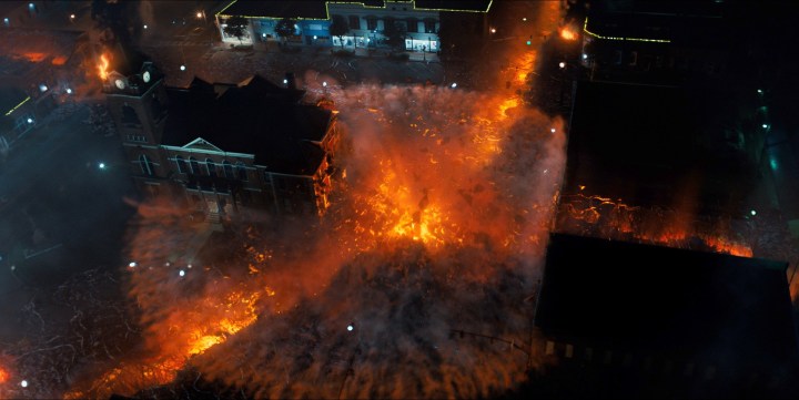 Arte de efeitos visuais retratando quatro fendas se unindo no centro da cidade em Stranger Things.