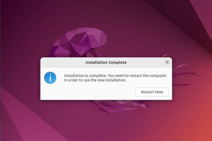 A grey box with 'Restart Now' button on the purple Ubuntu background