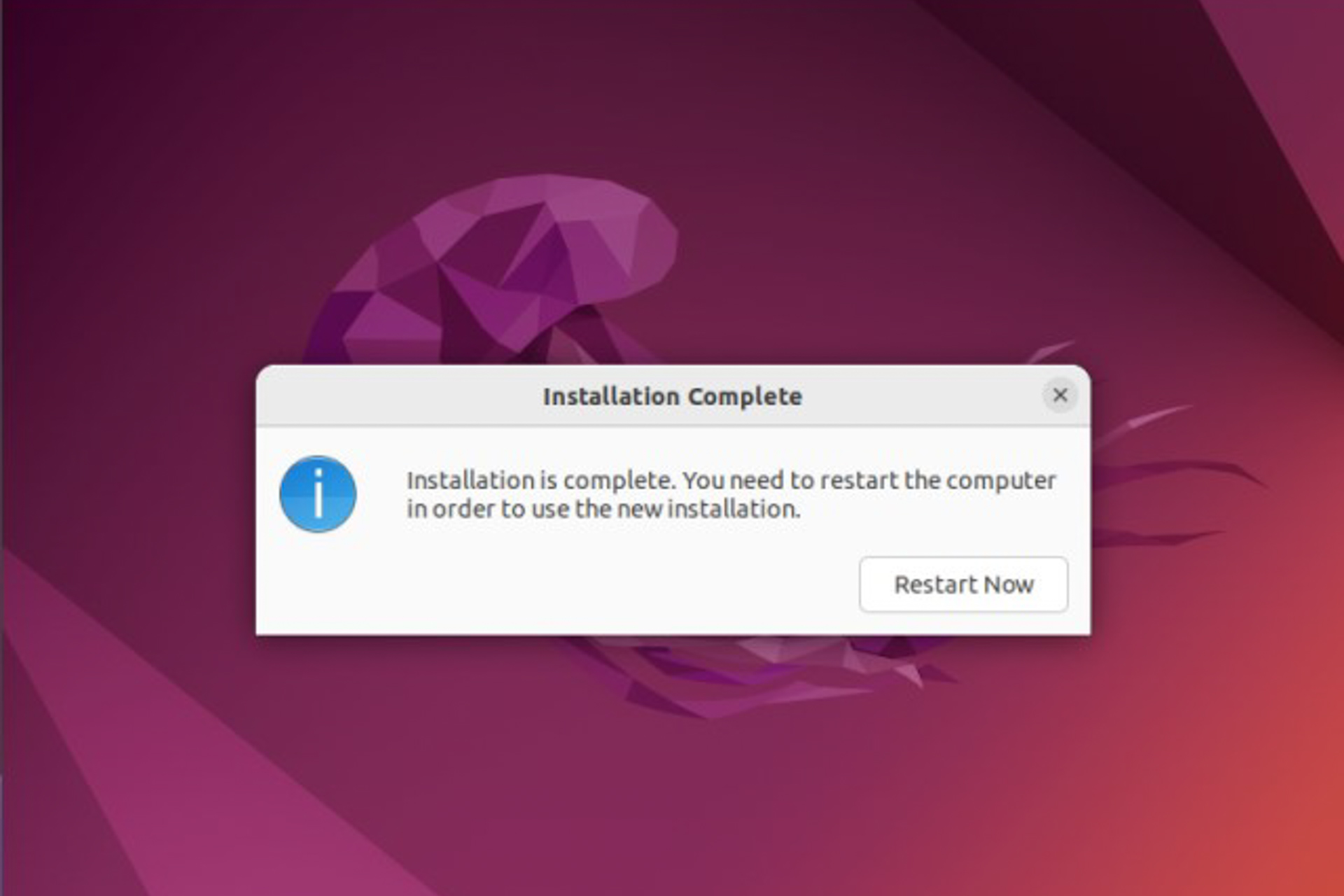 Uma caixa cinza com o botão 'Reiniciar agora' no fundo roxo do Ubuntu