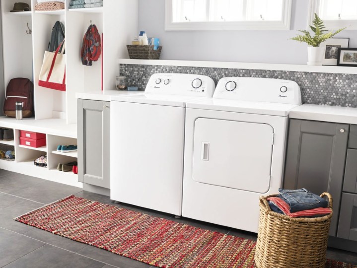 Amana High Efficiency Top Load Washer and Electric Dryer in a decorated laundry room.