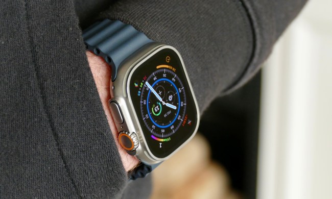 The Apple Watch Ultra on a man's wrist in a pocket.