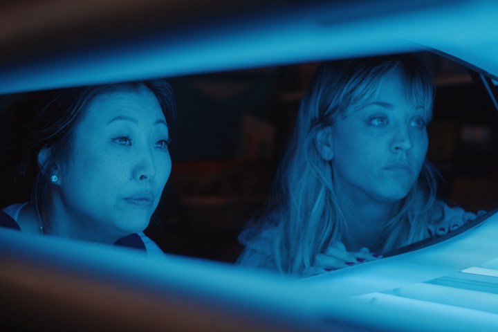 Deborah S. Craig and Kaley Cuoco watch in a tanning bed in Peacock's Meet Cute.