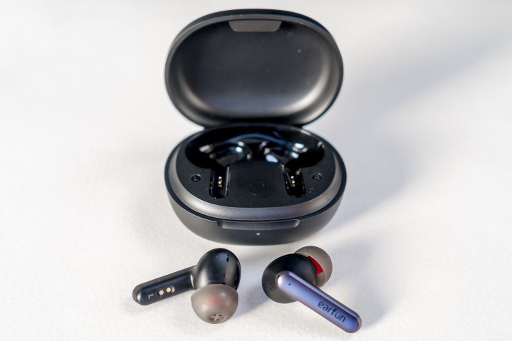 Earfun Air S earbuds loose in front of case.