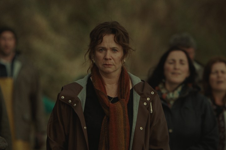 Emily Watson stands in a crowd in A24's God's Creatures.