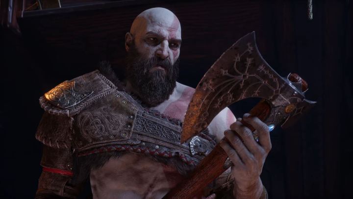 Kratos looks at Leviathan's axe.