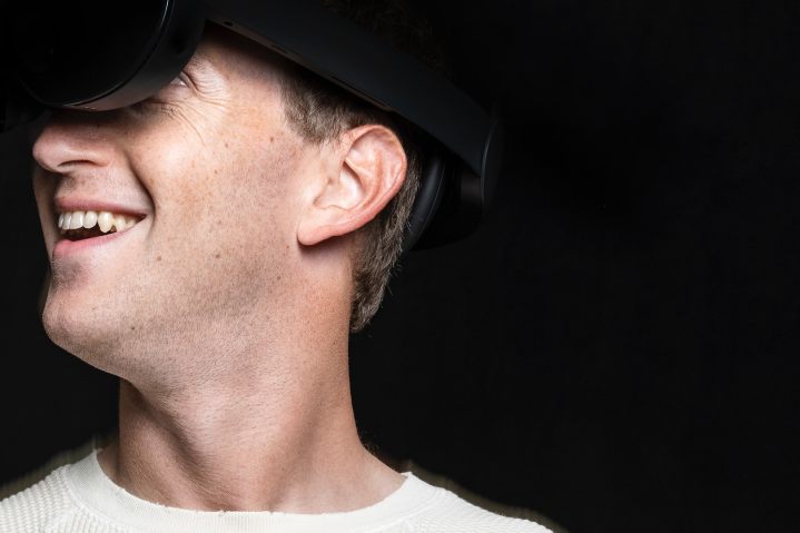 Mark Zukerberg is wearing a next generation VR headset.