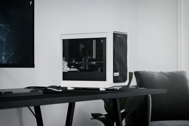 Product image of the Fractal Meshify 2 Nano mini-ITX case in white on top of a desk.