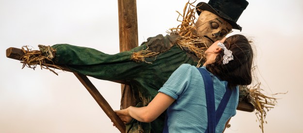 Mia Goth presses herself against a scarecrow in A24's Pearl.