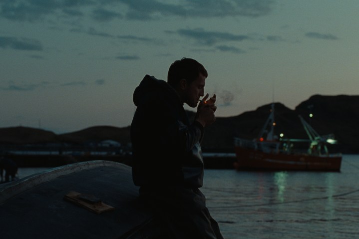 Paul Mescal lights a cigarette in A24's God's Creatures.