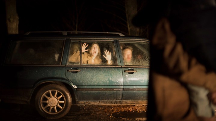 Morten Burian and Sidsel Siem Koch scream inside a car.