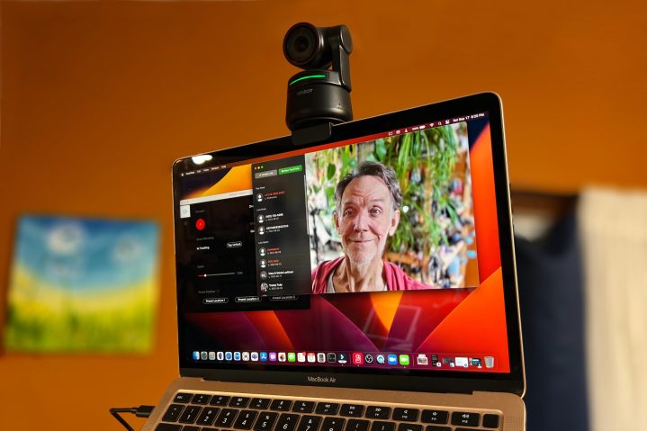 The Obsbot Tiny 4K webcam is mounted on a MacBook Air's screen.