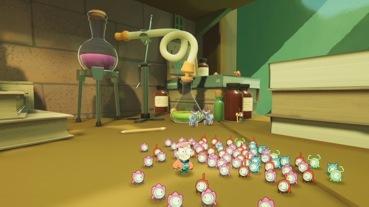 A group of Tinykin surrounding Milo in front of some scientific glassware.