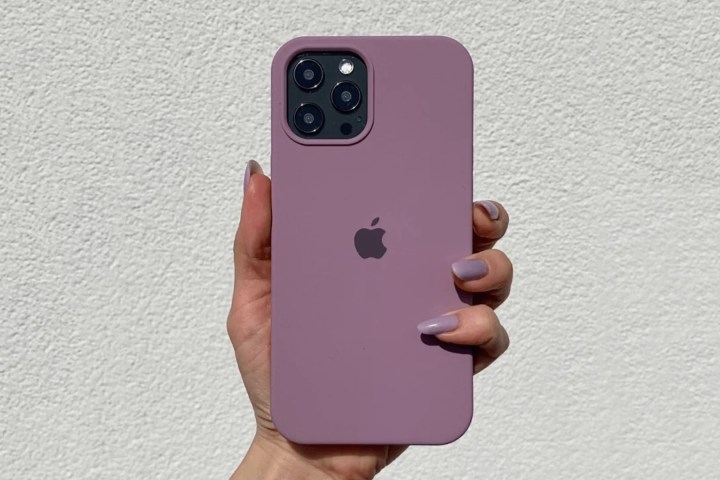 Hand holding Vogueen iPhone 14 pro Silicone Case.