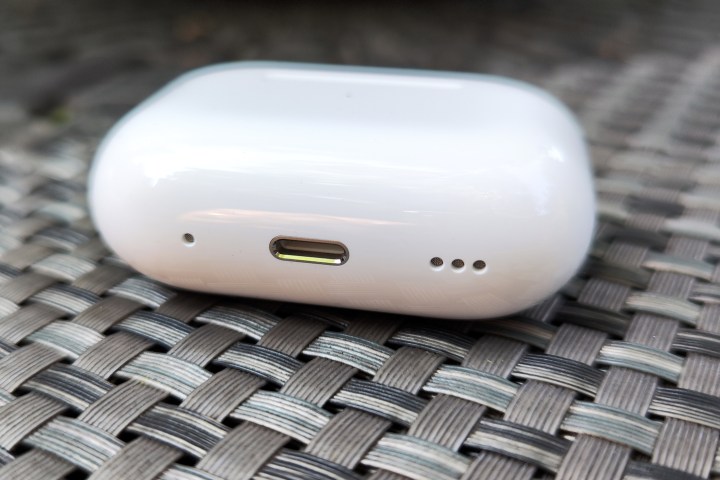Apple AirPods Pro 2 charging case charging port and speaker close-up.