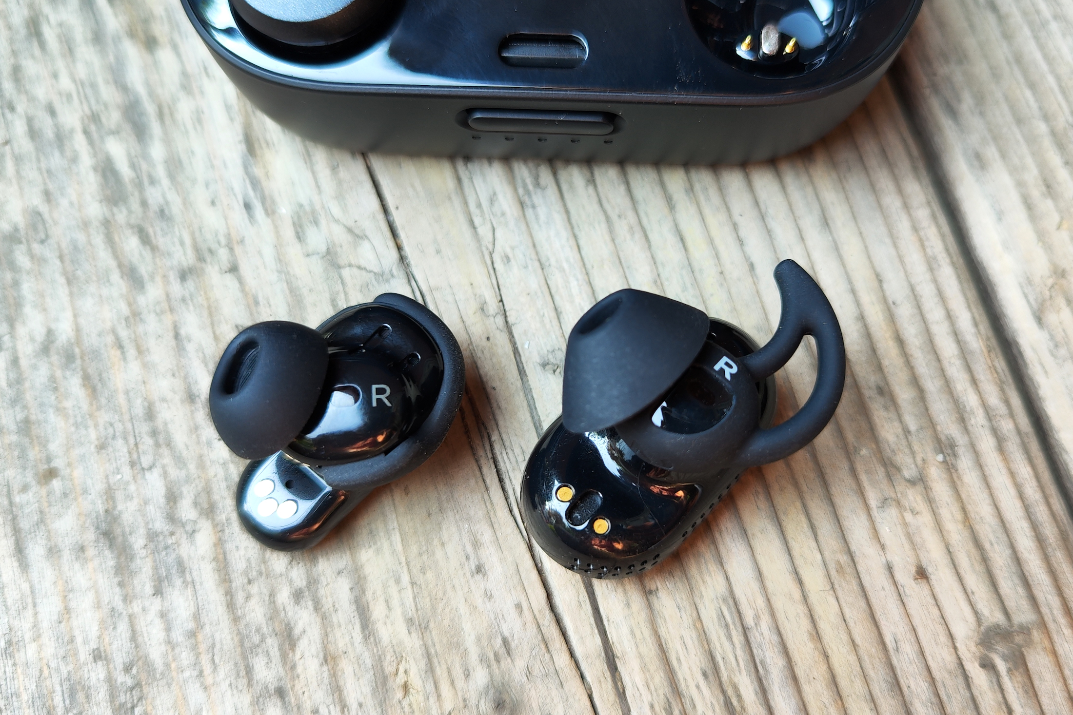 First and second-gen Bose QuietComfort Earbuds seen side-by-side.