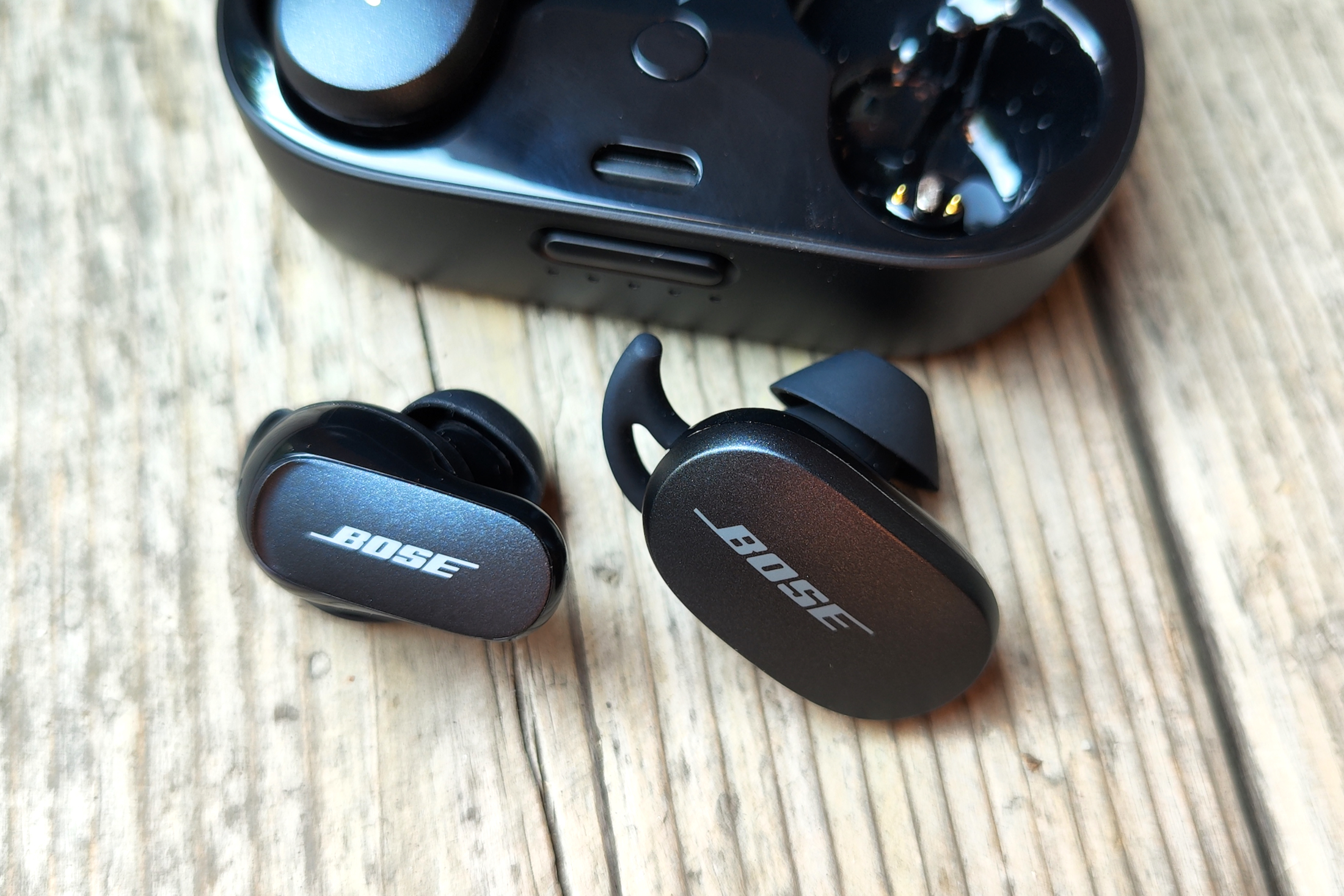 First and second-gen Bose QuietComfort Earbuds seen side-by-side.
