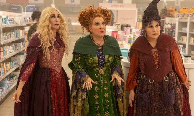 Sarah Jessica Parker, Bette Midler, and Kathy Najimy stand in a convenience store in a scene from Hocus Pocus 2.