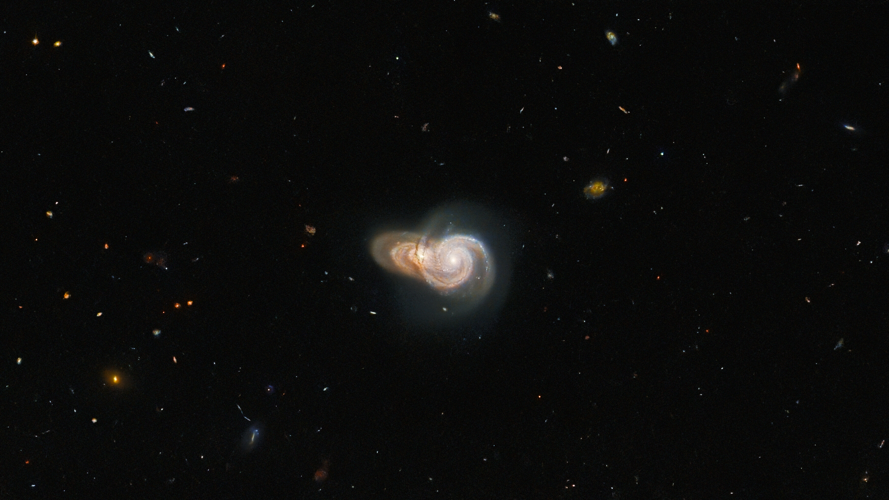 Hubble image shows two overlapping galaxies