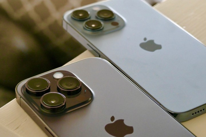 The iPhone 14 Pro and iPhone 13 Pro seen from the back.