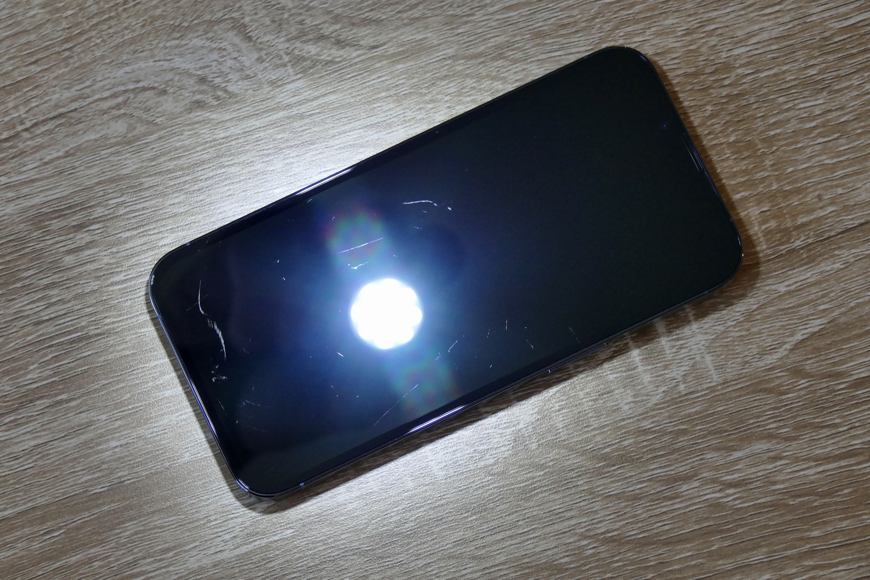 An iPhone 13 Pro showing the Ceramic Shield glass performance.