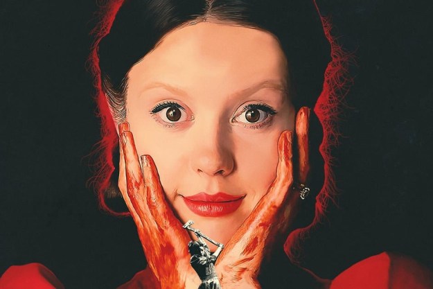 Mia Goth stirrer på kameraet i plakaten for Pearl