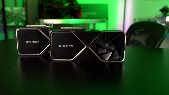 The RTX 4090 and RTX 3090 sitting on a table side-by-side.