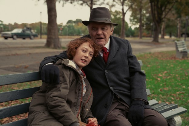 Anthony Hopkins and Banks Repeta sit on a park bench together in Armageddon Time.