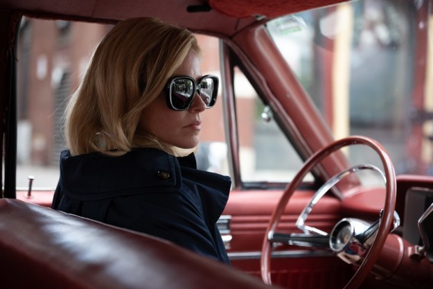 Elizabeth Banks wears sunglasses in a car in Call Jane.