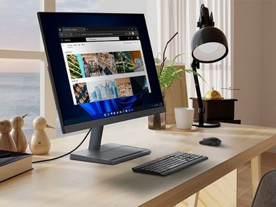 Lenovo L27q-35 27-inch QHD monitor sits on a desk in a home office.