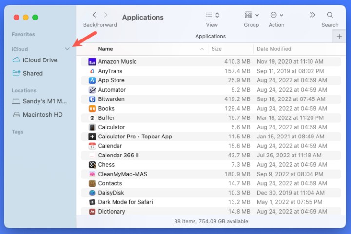 Arrow to expand a section in the Finder sidebar.