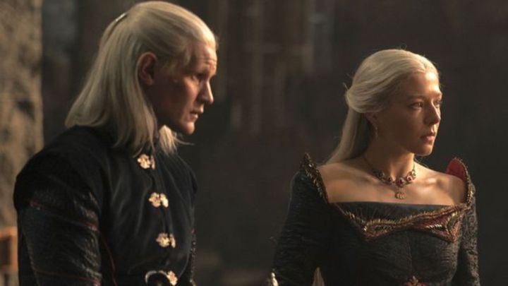 Daemon and Rhaenyra Targaryen looking in the same direction with confused expressions in House of the Dragon.