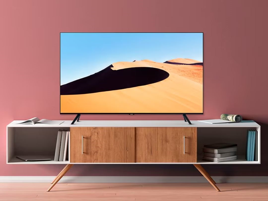 Samsung 75 Class TU690T Series LED 4K UHD Smart Tizen TV in living room.