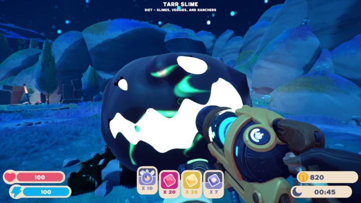A player holding a Tarr Slime in Slime Rancher 2.