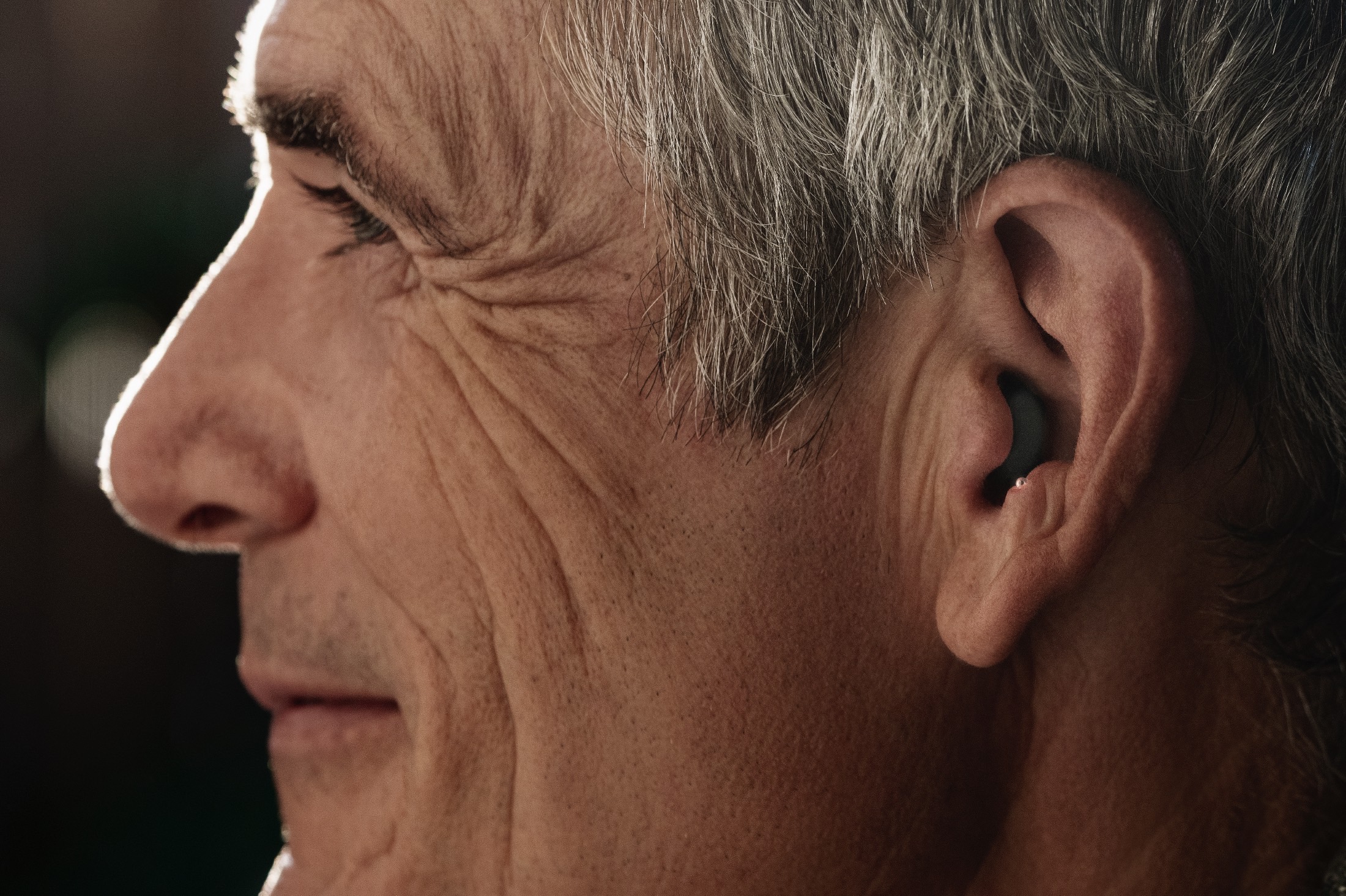 Man wearing Sony CRE-C10 OTC hearing aids.
