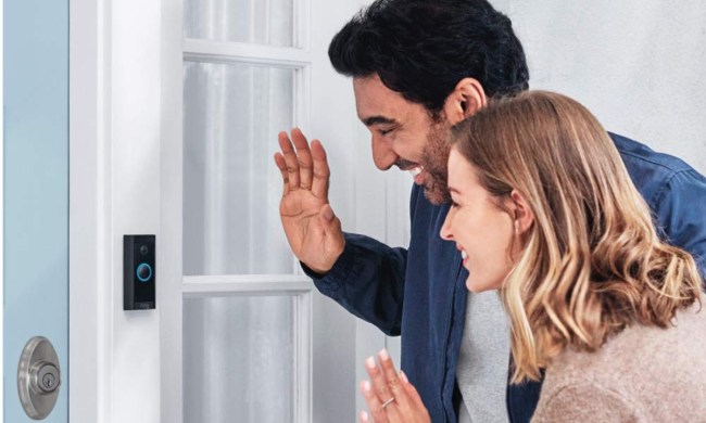 Two people saying hi with a Ring Video Doorbell Wired.