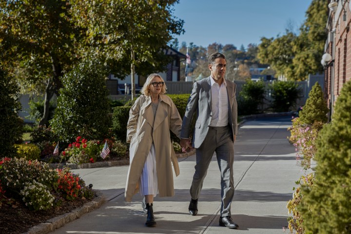 Naomi Watts and Bobby Cannavale walk in unison in a scene from Netflix's The Watcher.